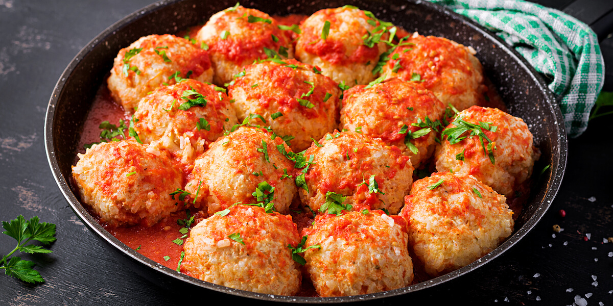 Meatballs in sweet and sour tomato sauce.