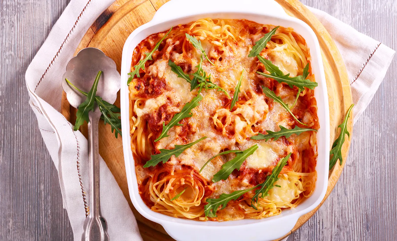 Baked spaghetti in a white baking dish