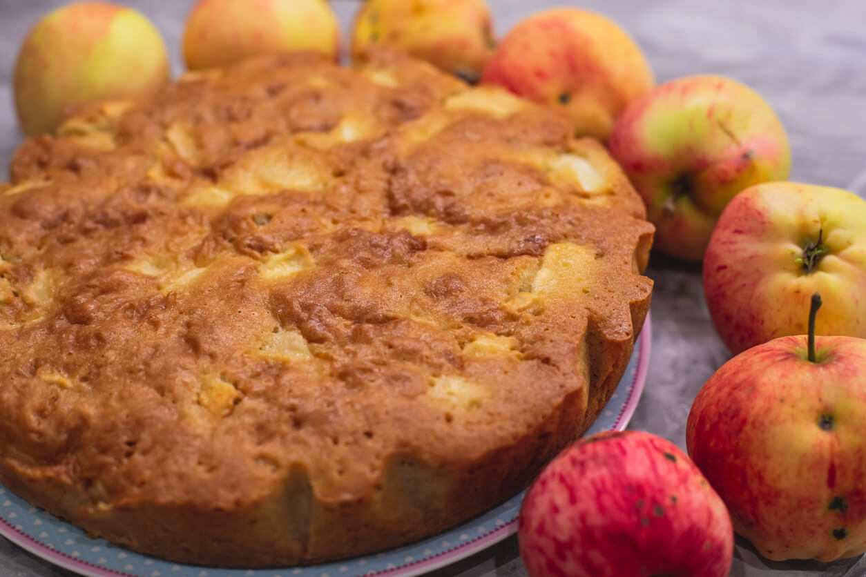 View of Sharlotka cake - traditional seasonal apple homemade baked sponge pie.