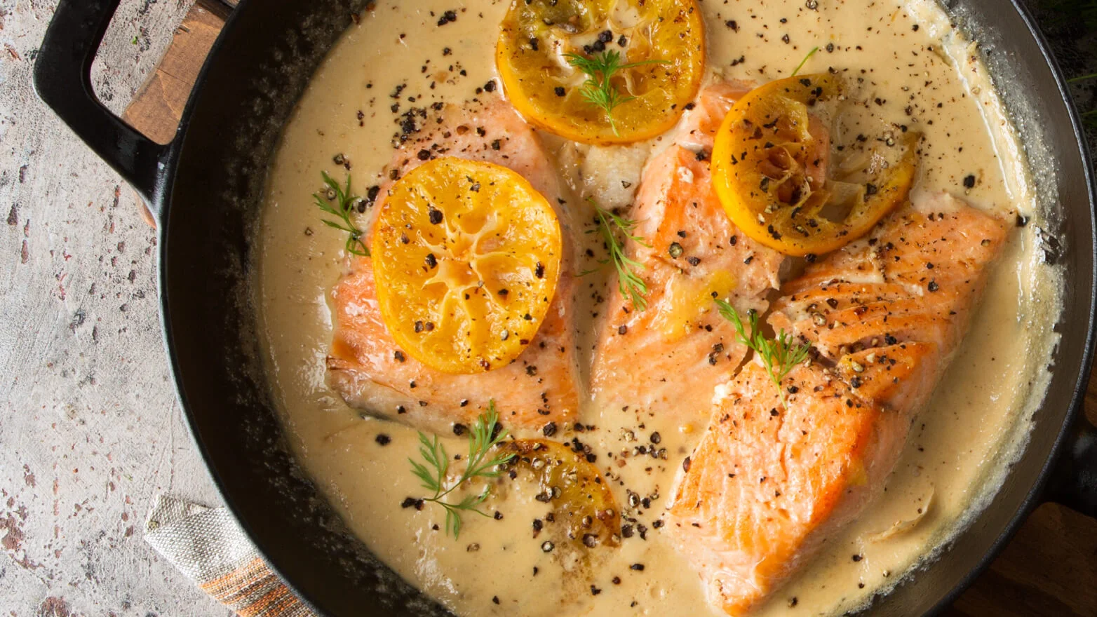 a photo of pan fried salmon with lemon butter sauce