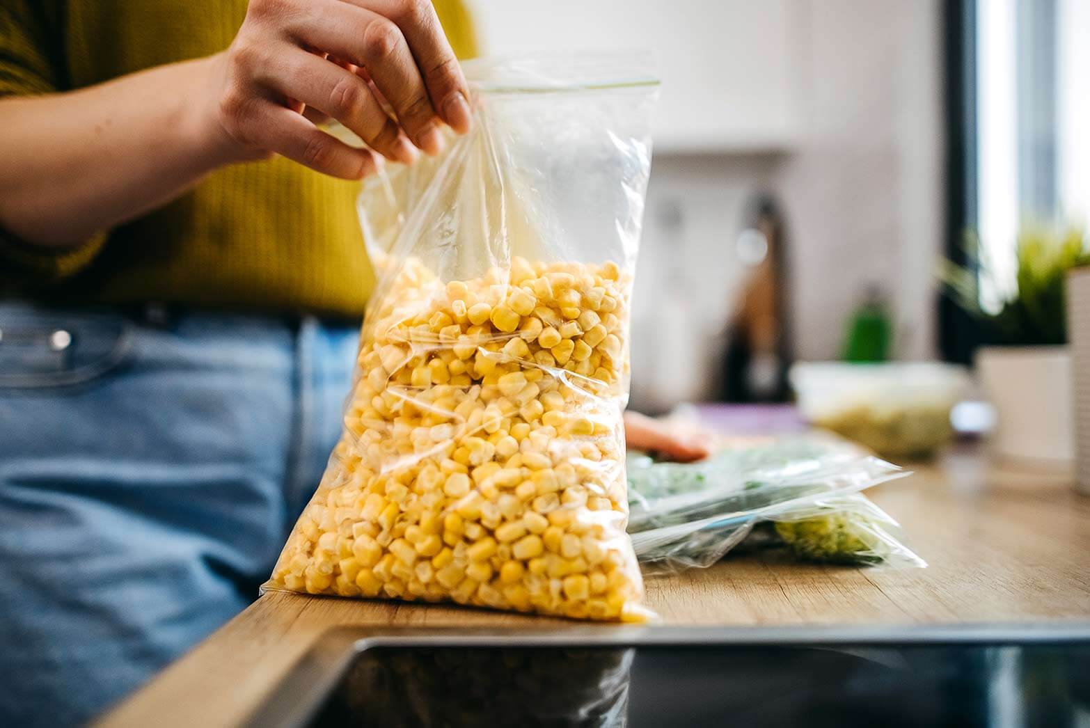 person using their leftover food for a new meal