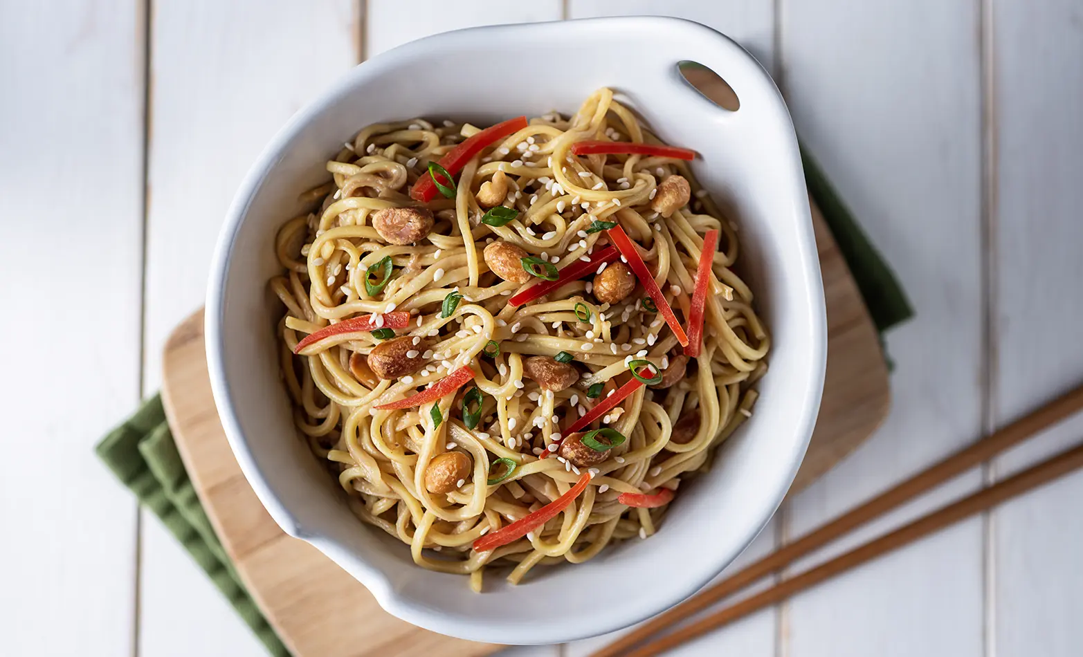 Spicy sesame noodles with chicken and peanuts