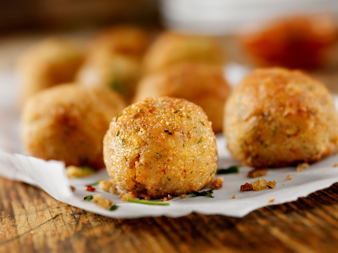 cheese Arancini on a table.