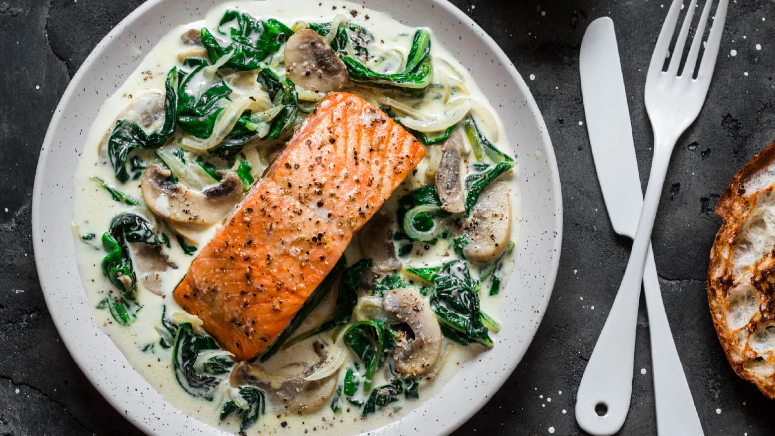 a photo of a creamy salmon filet on a plate