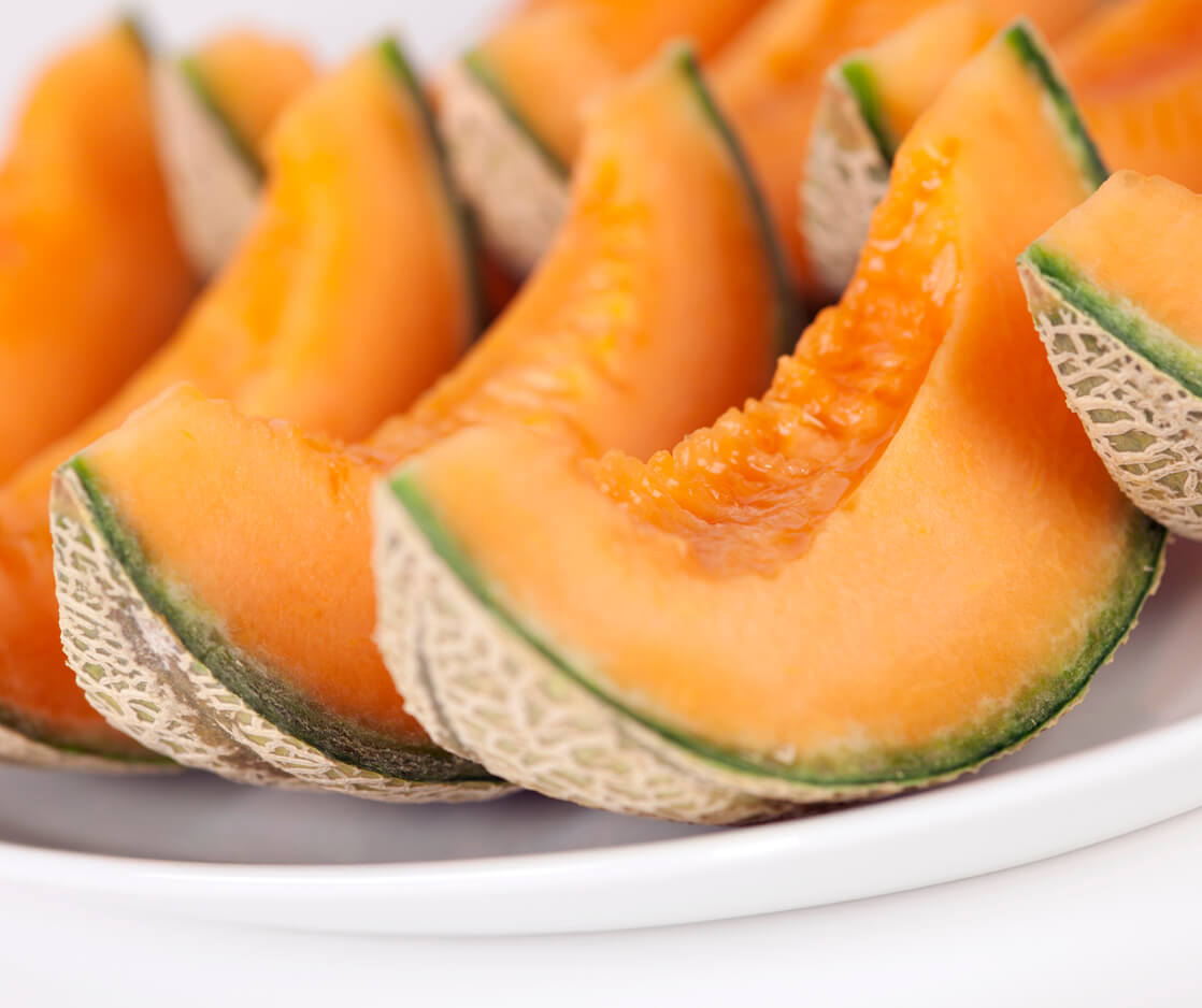 Portions of Cantaloupe on plate.