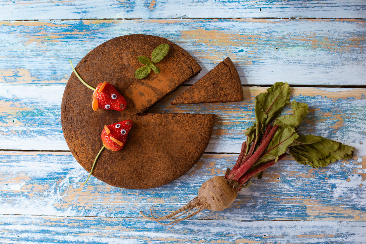 Beet and chocolate cake on a blue vintage table