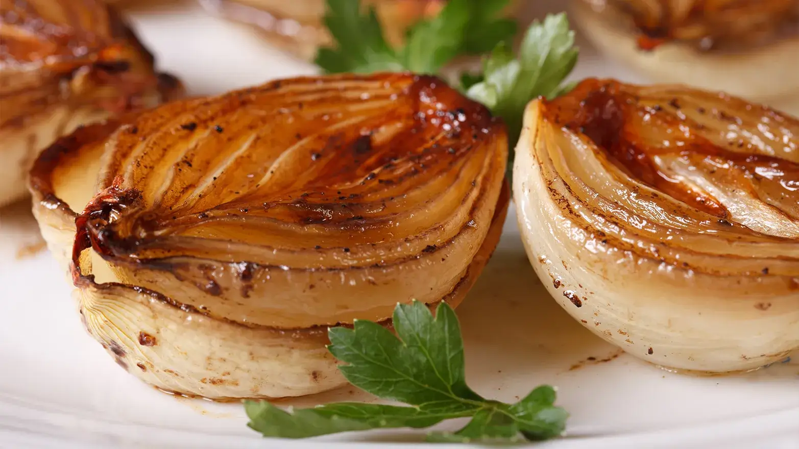 Caramelized roasted onion halves.