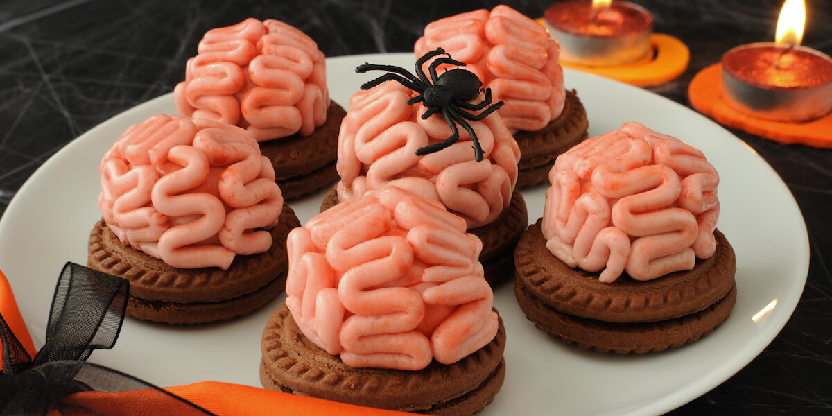 Funny cookie with brains of marzipan on Halloween.