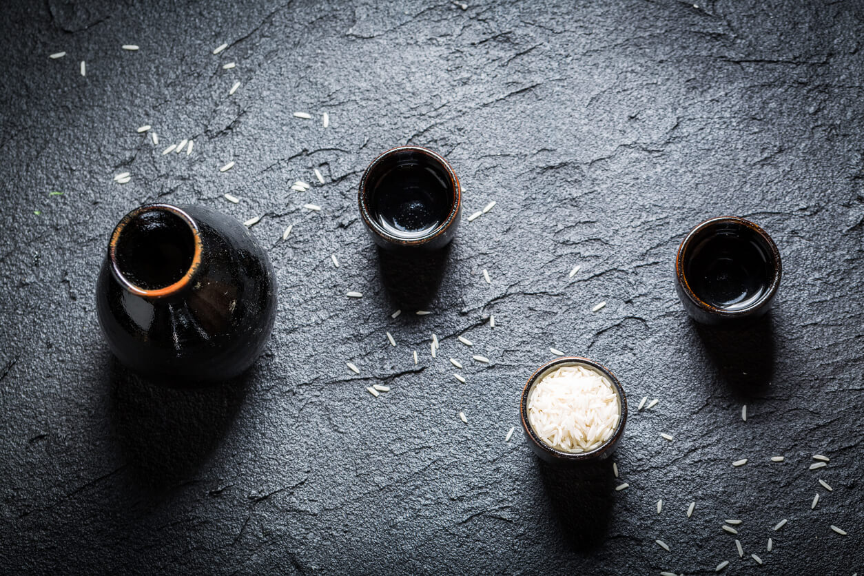 Strong sake in black ceramics on black rock