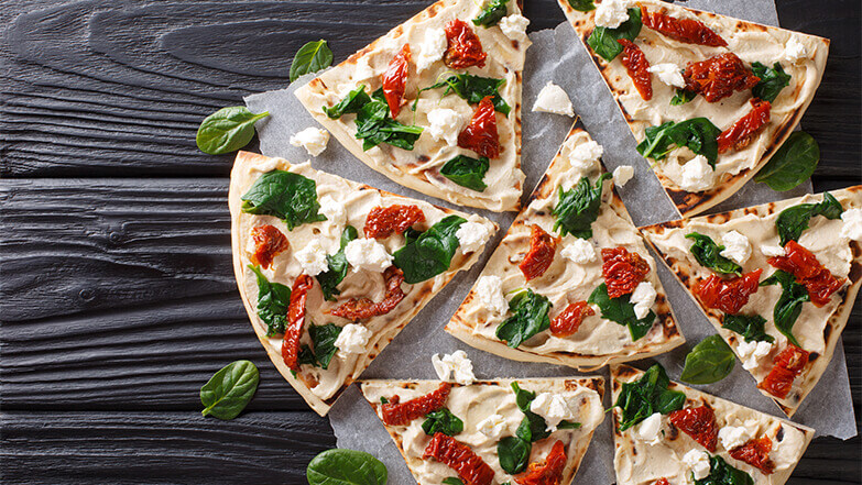 Sub tomato sauce for hummus for a mediterranean-inspire pizza.