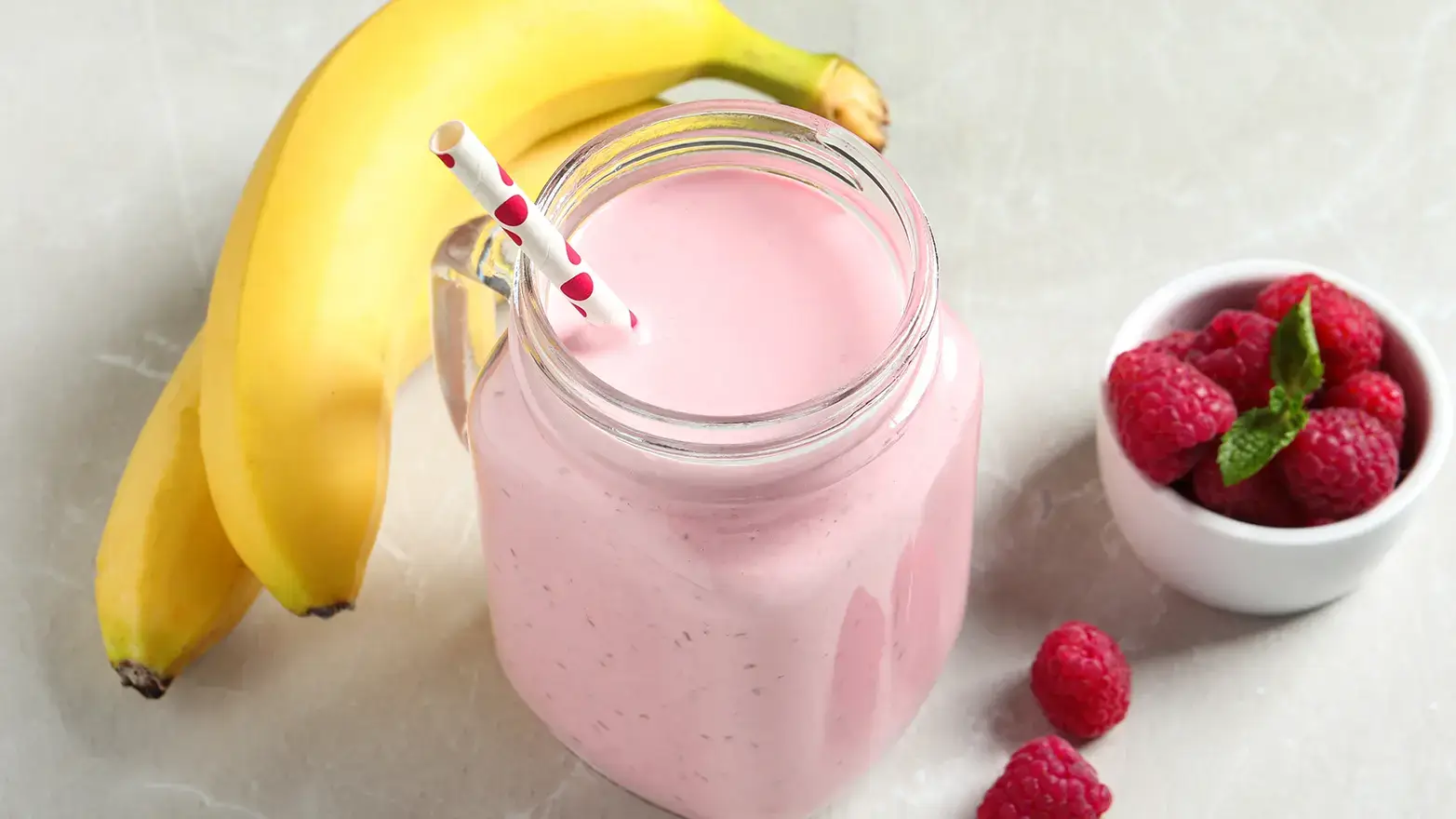 Photo of banana raspberry smoothie with yogurt