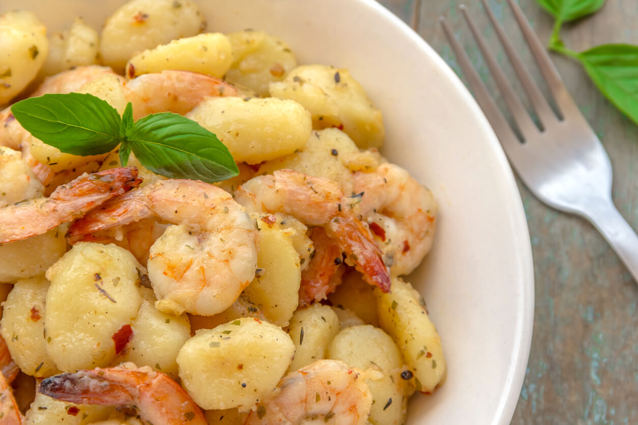 Shrimp gnocchi on a plate.