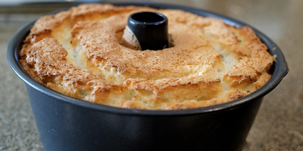 Angel Food cake in tin after baking in oven.
