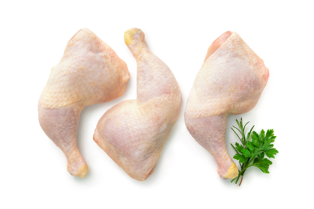 Raw chicken legs isolated on white