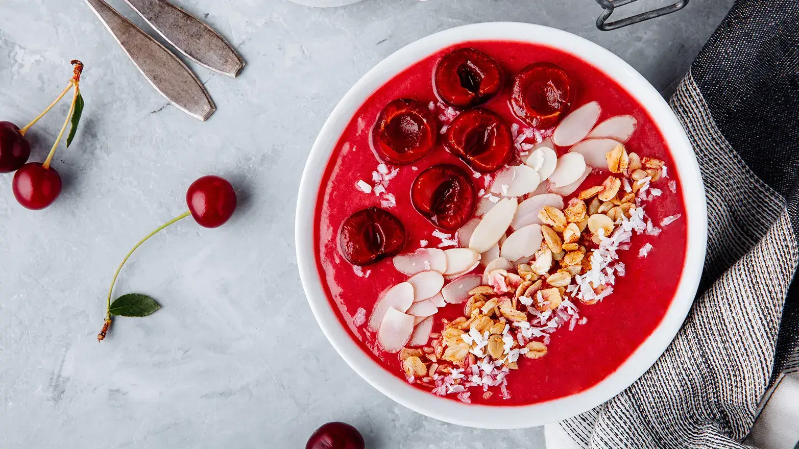 Photo of cherry almond smoothie bowl with granola