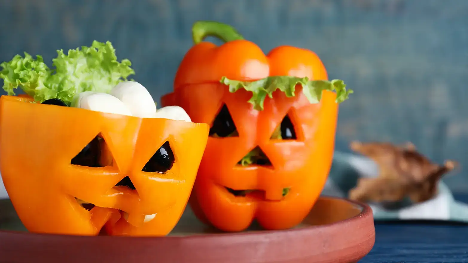 stuffed peppers carved like jack-o-lanterns