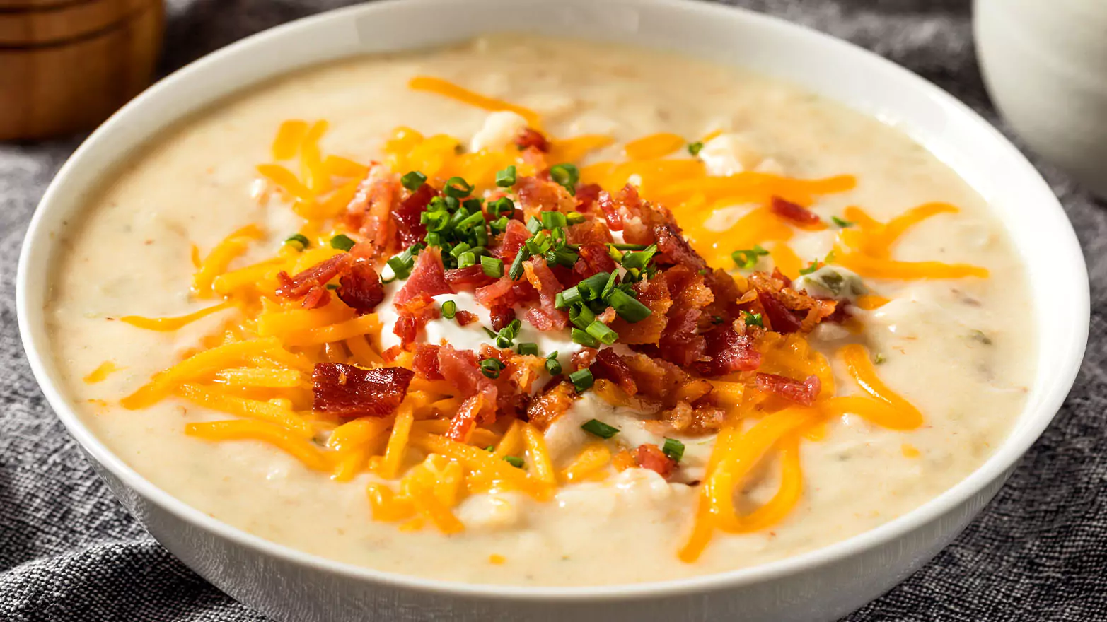 A bowl full of loaded baked potato soup.