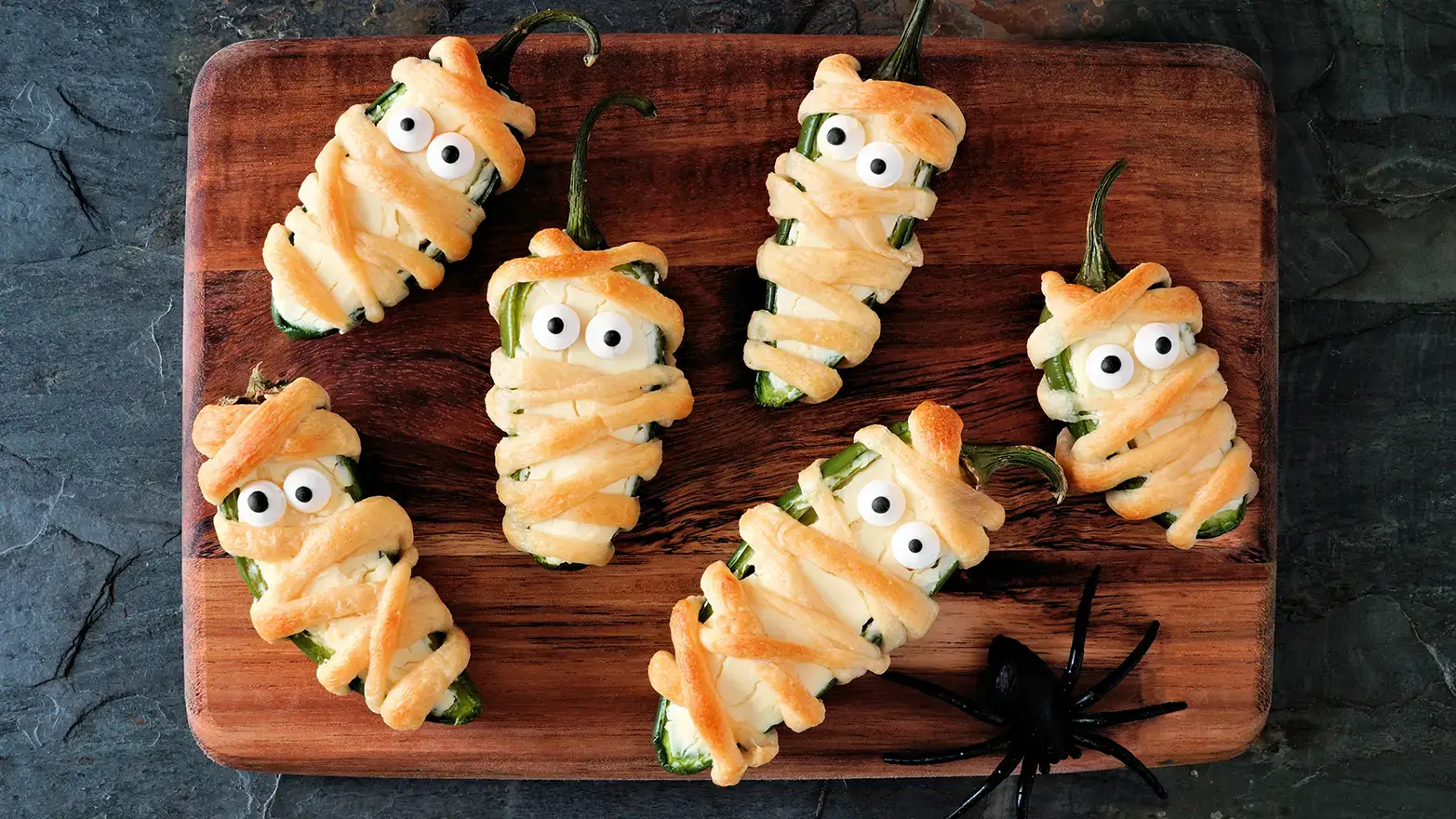 Jalapeno poppers wrapped in pastry dough with edible eyeballs