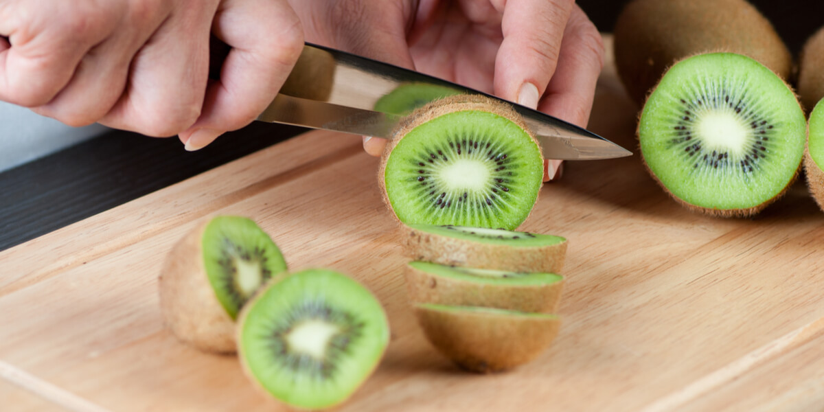 Cutting a kiwi.