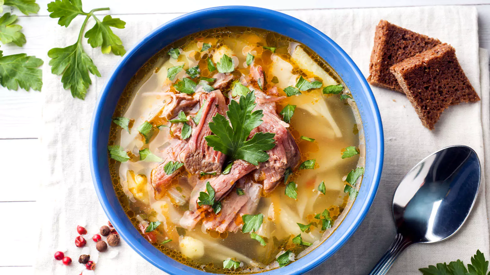 A bowl of corned beef cabbage soup.