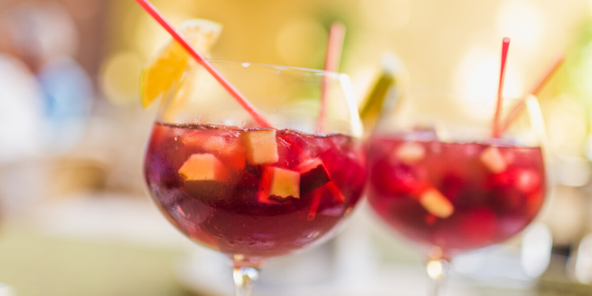 Two refreshing glasses of sangria with fruits, waiting to be savored.