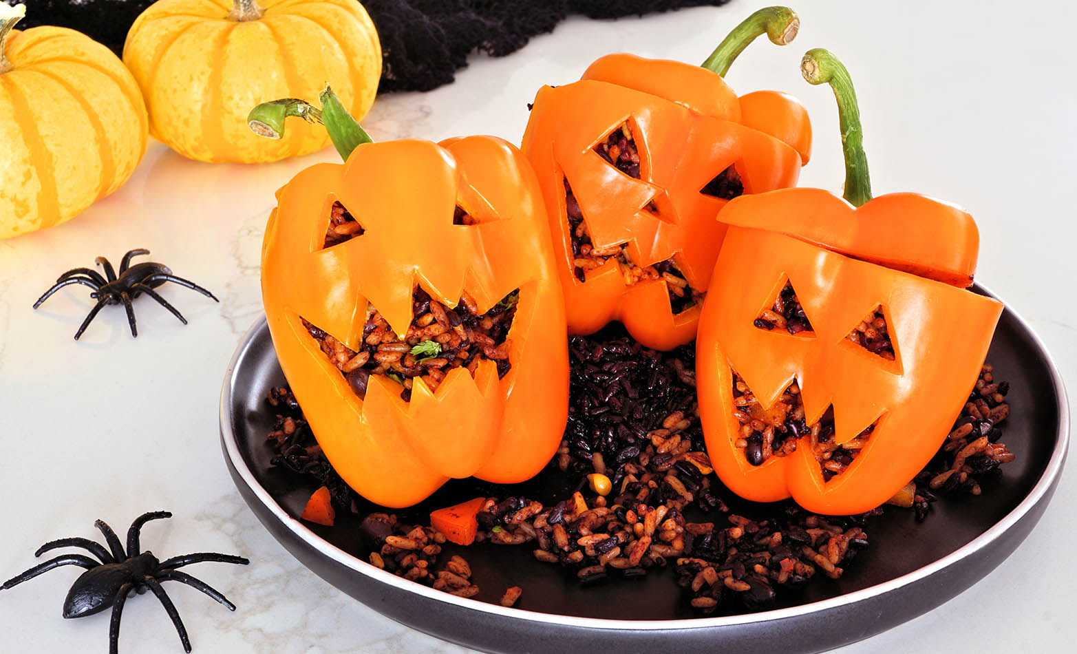 Jack-o’-lantern stuffed peppers