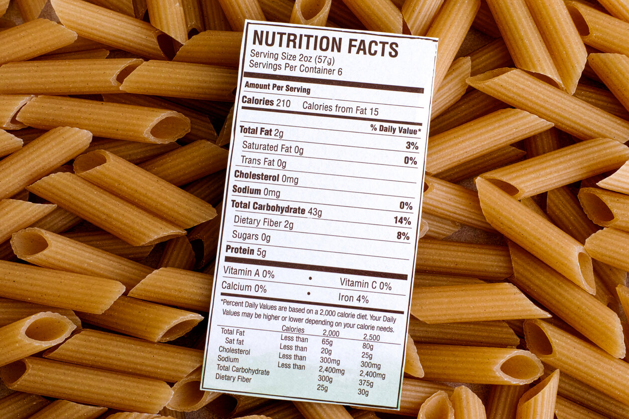 Nutrition facts of Brown Rice Pasta on pasta background.
