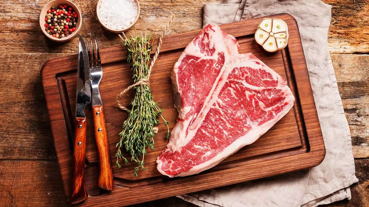 t-bone seak ready to be seasoned and grilled