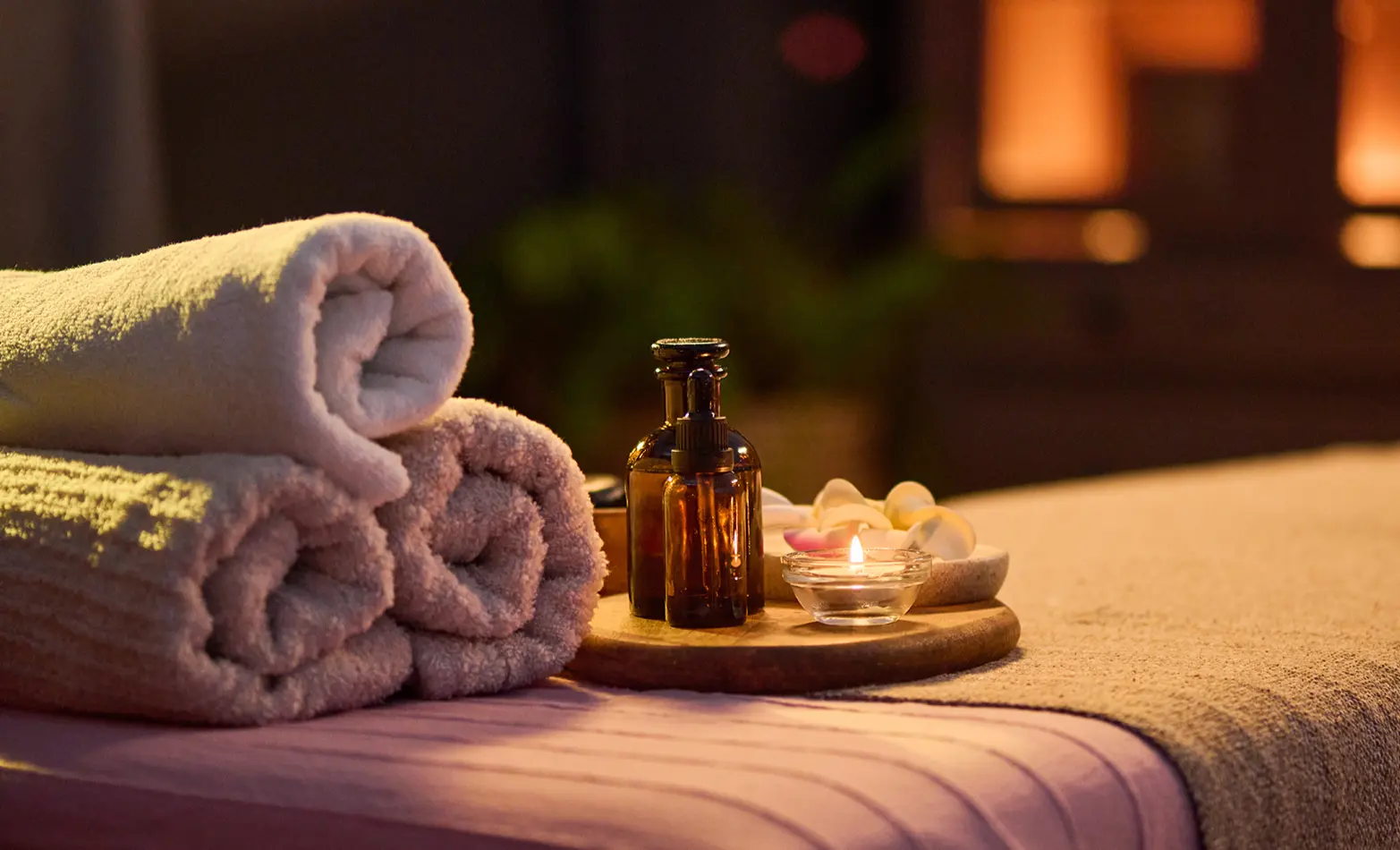 A photo of a massage table with towels.
