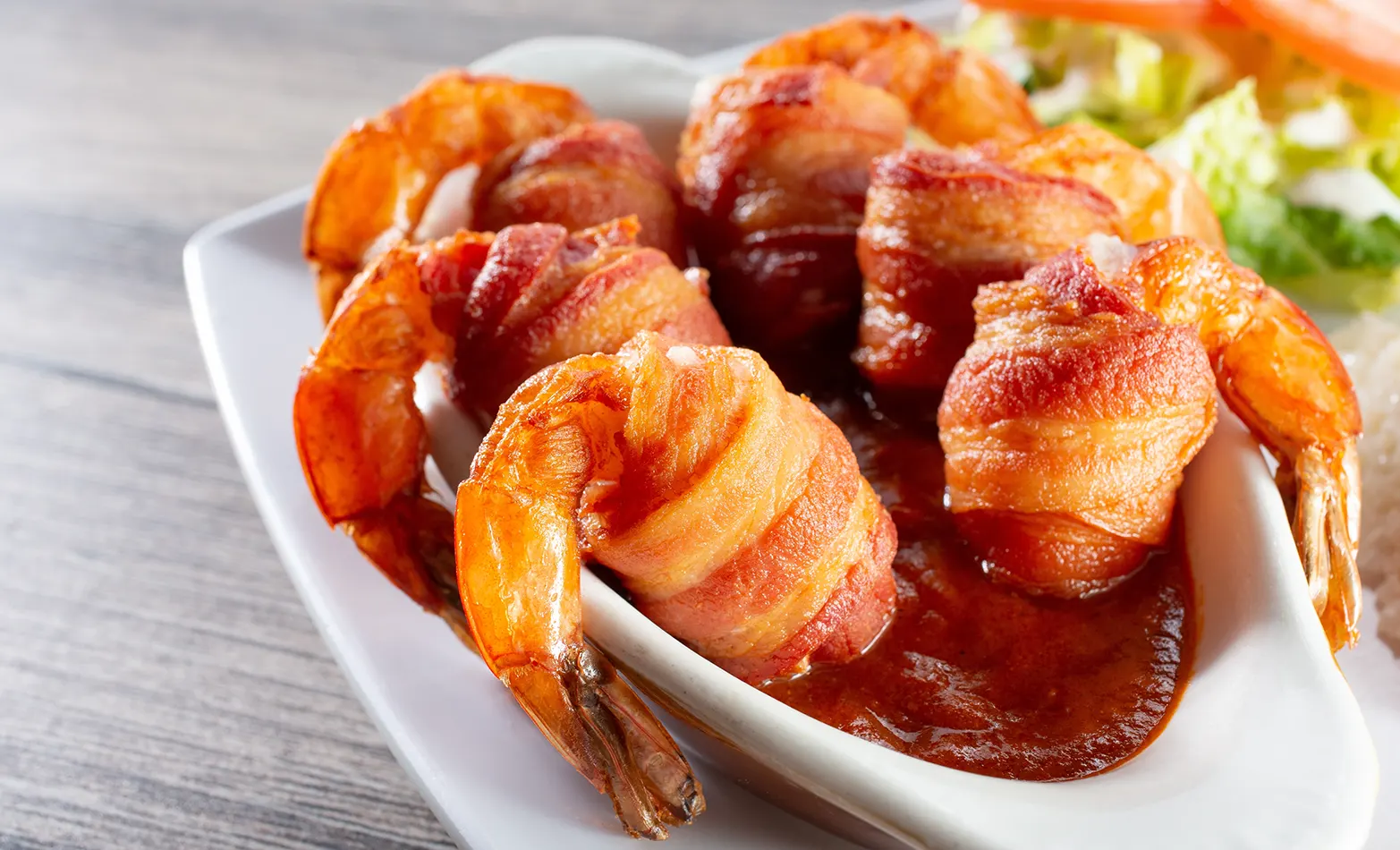 bacon-wrapped shrimp with arugula salad