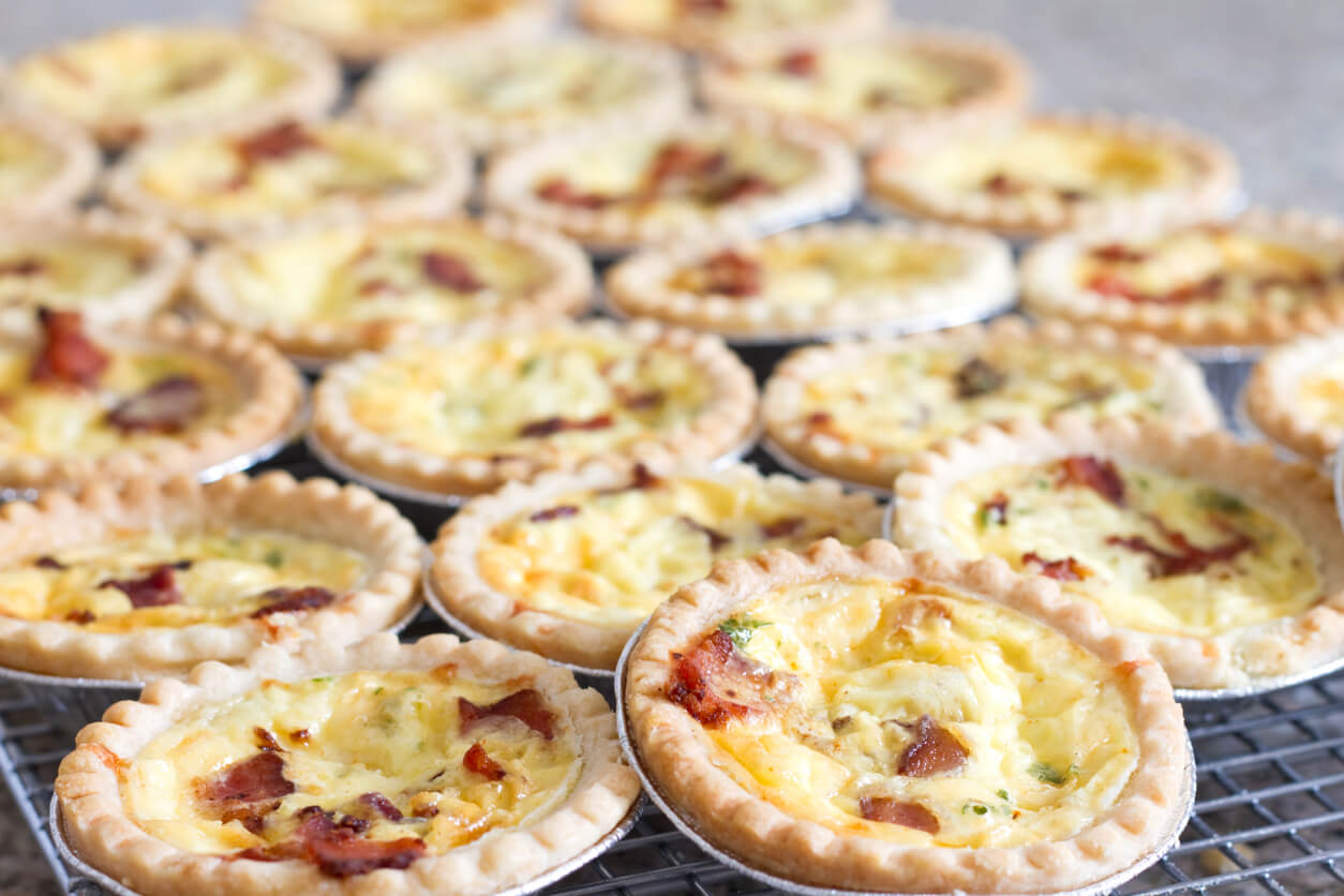 Individual jam tart size quiches.