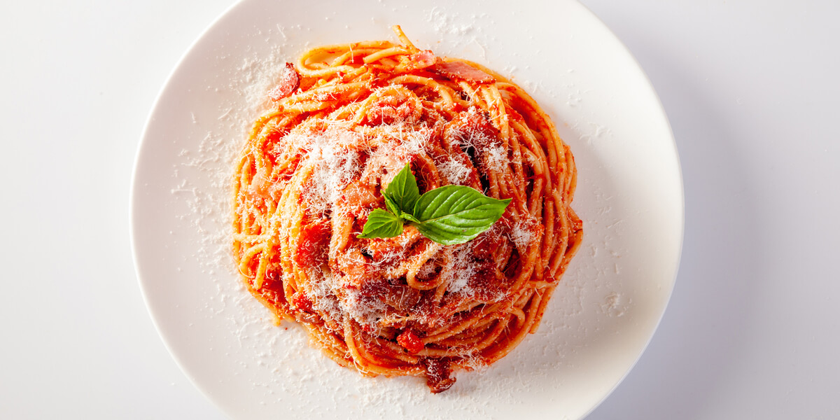 Spaghetti in a dish on a white background