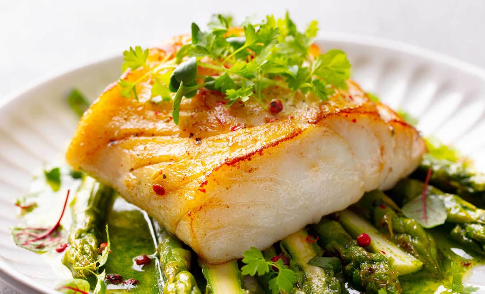 a stock photo of grilled cod with lemon herb butter
