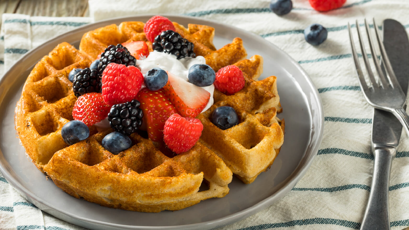 Belgian waffles with berries and cream