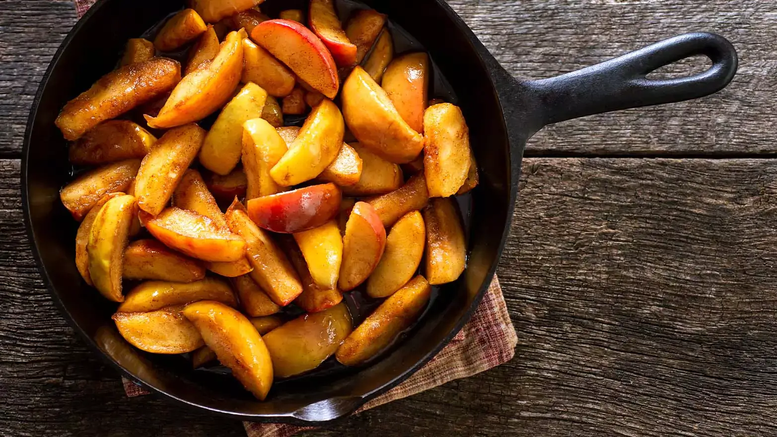 Cinnamon spiced fried apples in a skillet