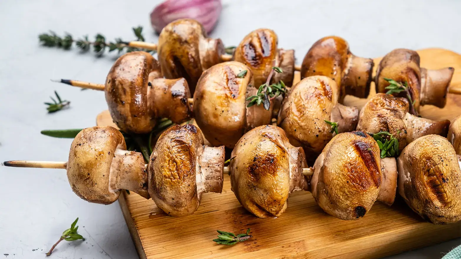 Marinated mushrooms on skewers for birthday dinner
