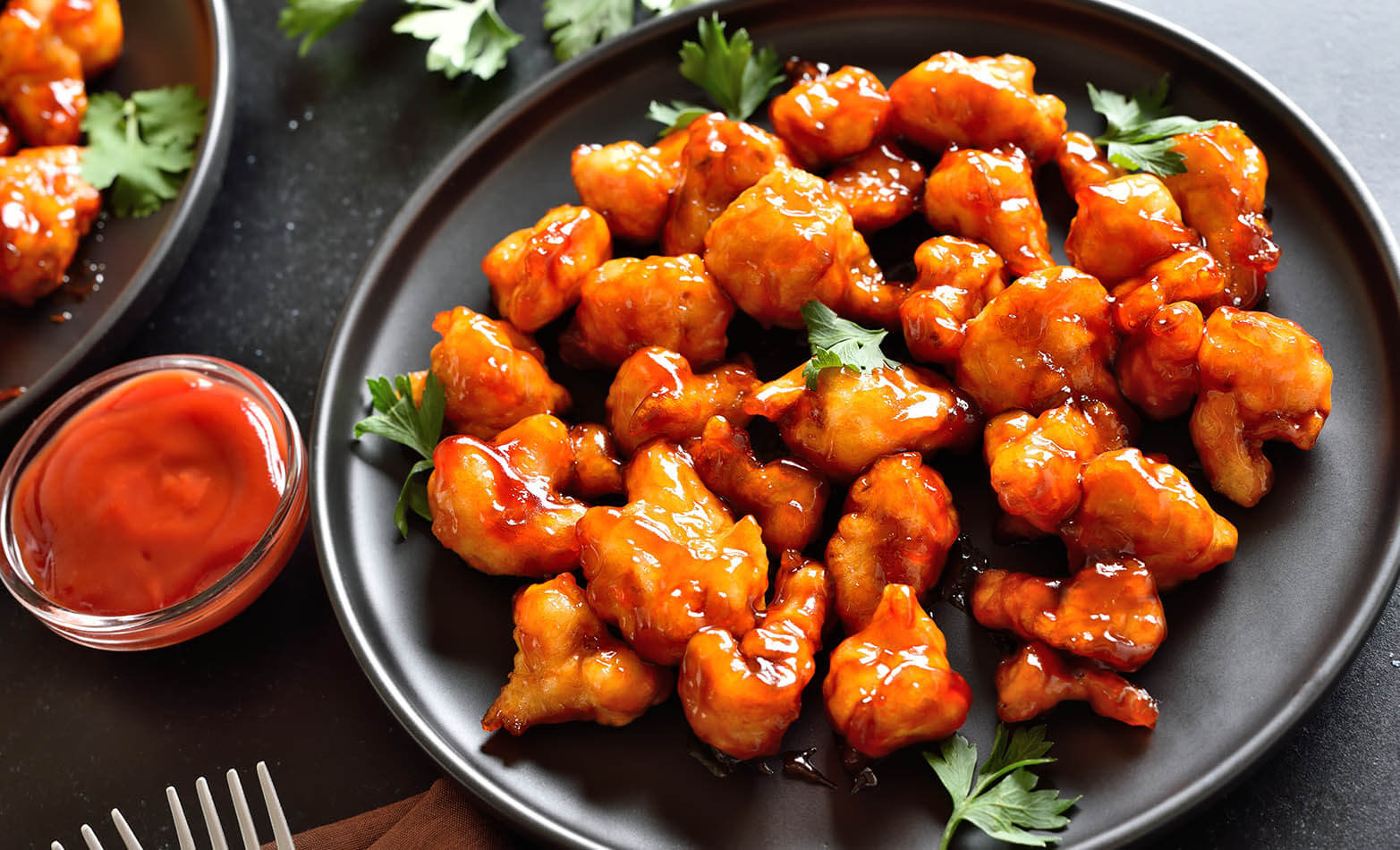 a plate of buffalo cauliflower bites