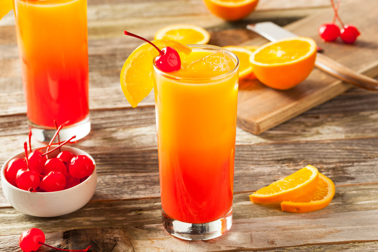Juicy Orange and Red Tequila Sunrise with a Cherry