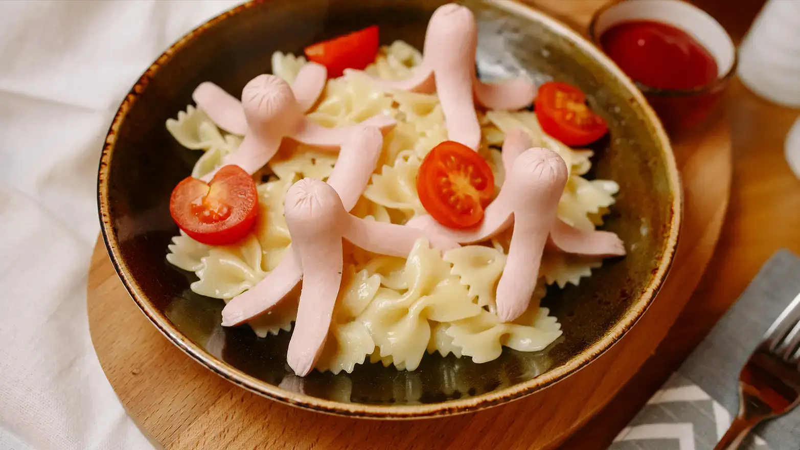 Hot dogs cut to resemble octopuses with pasta