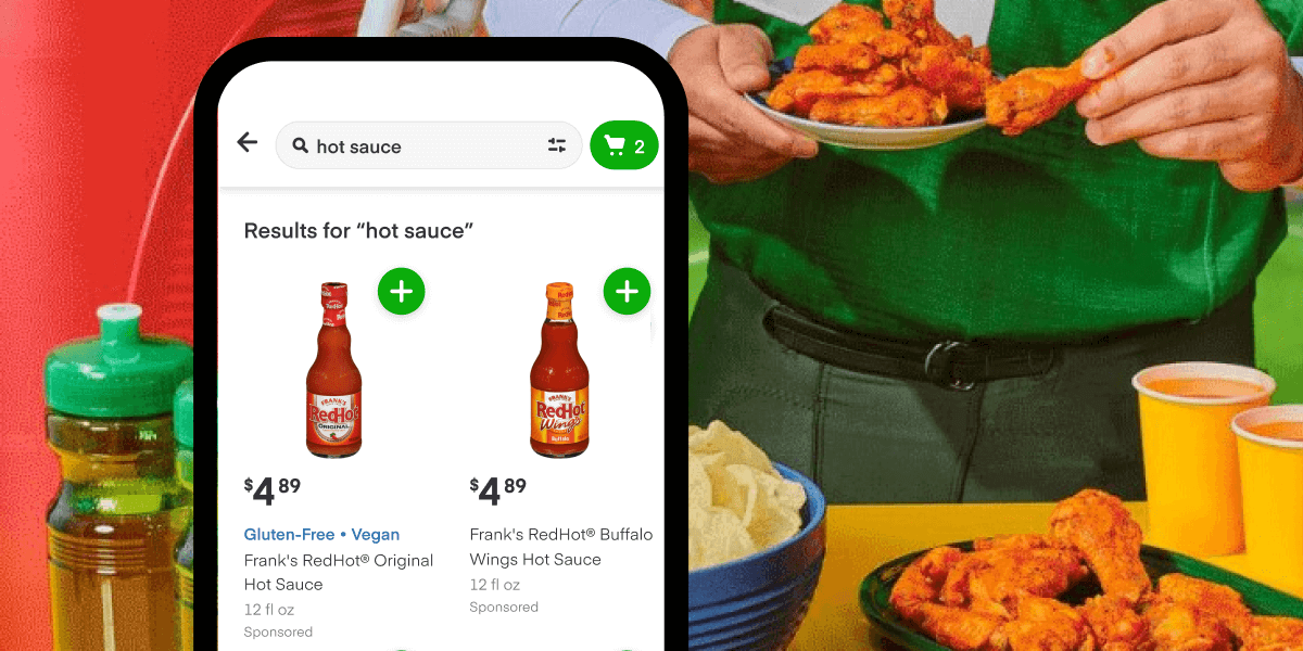 Smartphone with Instacart app. Searching for 'hot sauce' and finding Frank's RedHot. 