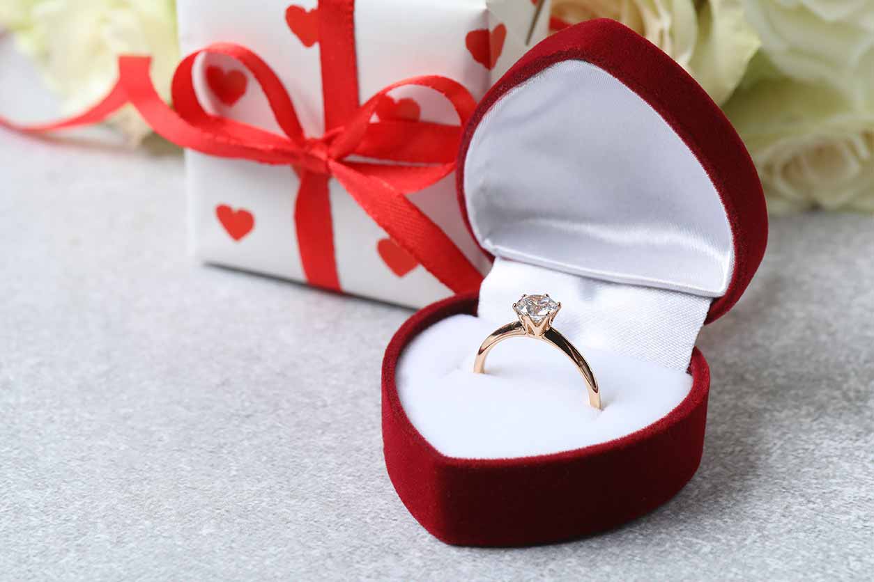 a ring presented in a heart-shaped box