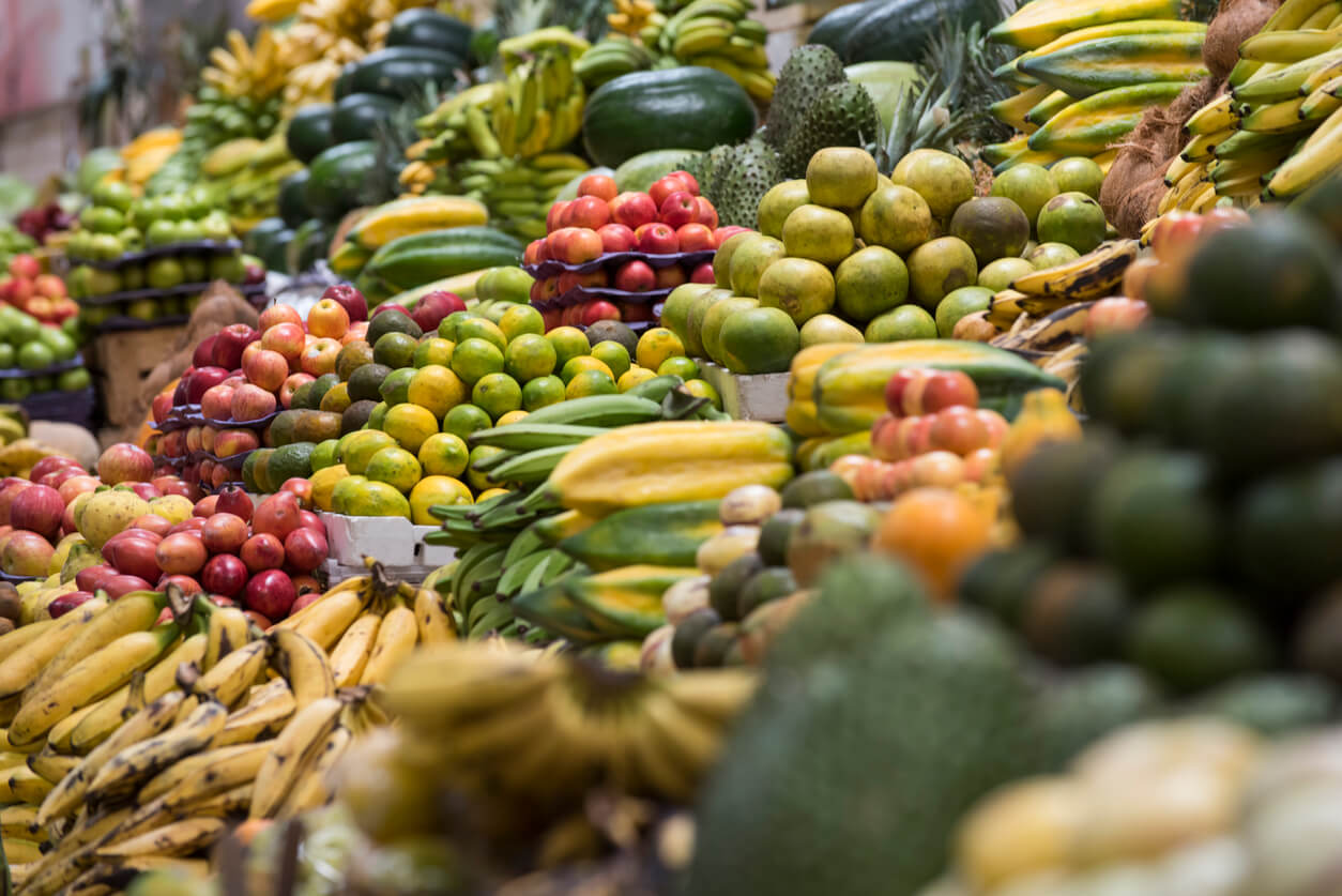 Large heap of tropical fruit for sale in authentic market, Quito, Ecuador.
