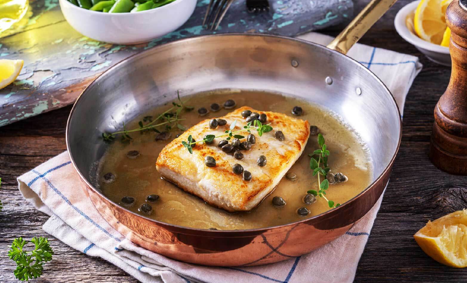 a stock photo of mahi mahi with lemon caper sauce