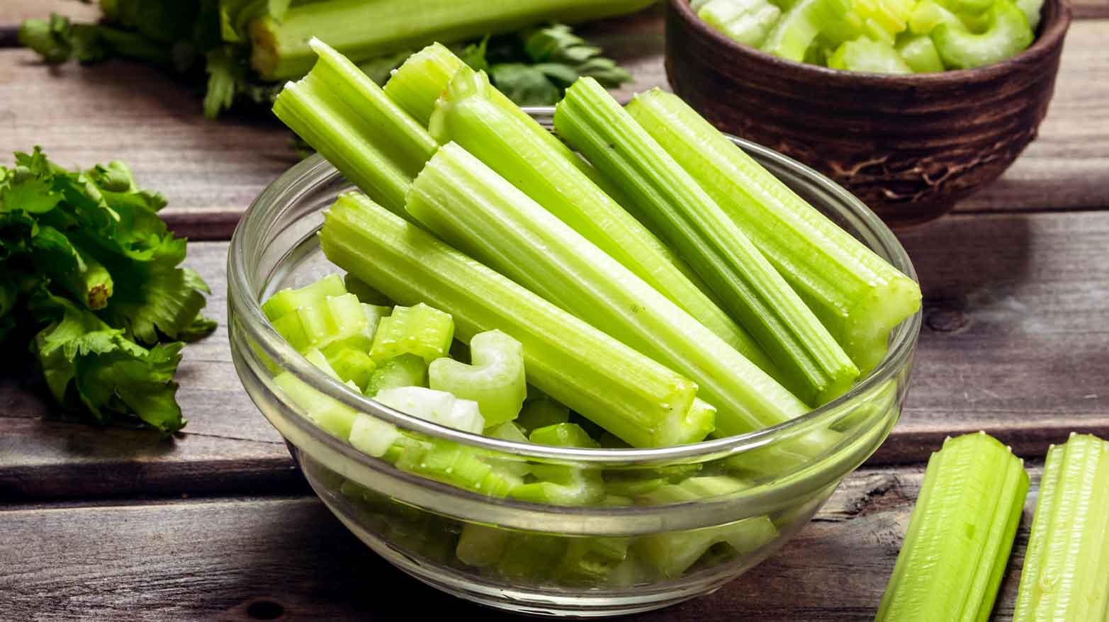 Chopped celery in a glass bowl