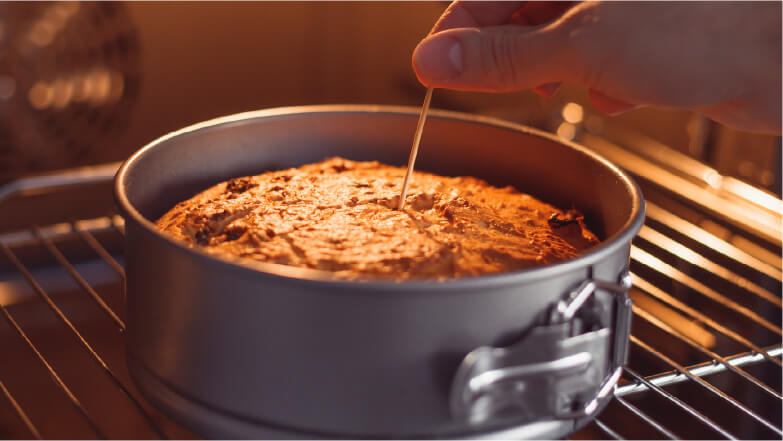 toothpick checking the doneness of a cake