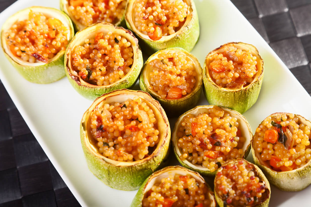 Zucchini stuffed with couscous served in a plate