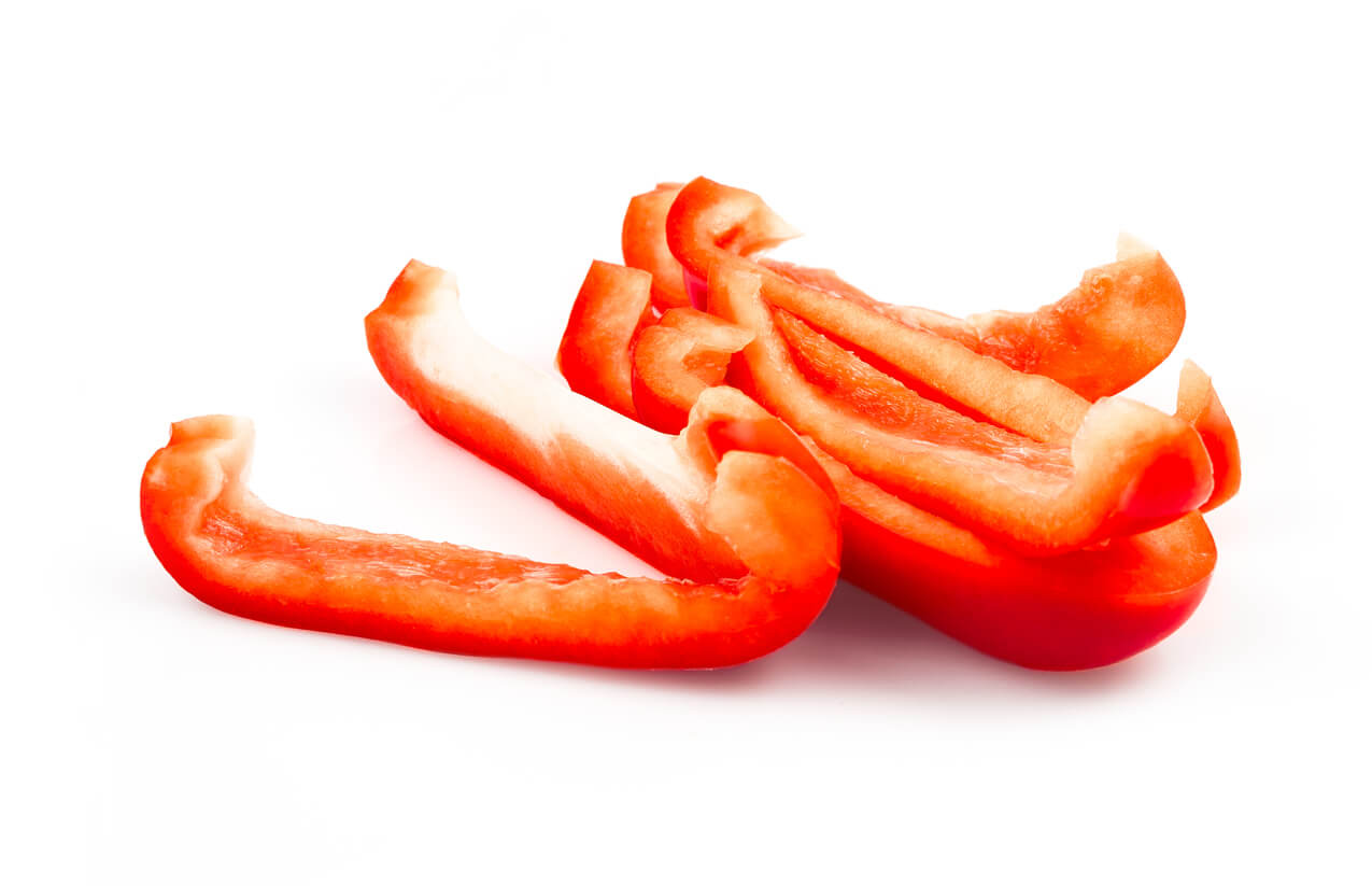 Sliced red sweet pepper isolated on white background cutout.