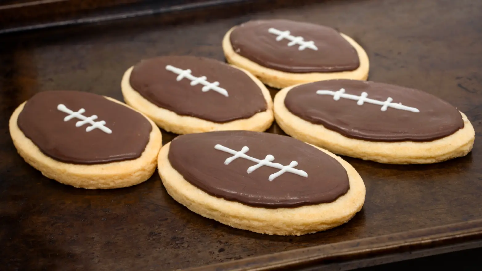 sugar cookies decorated like footballs