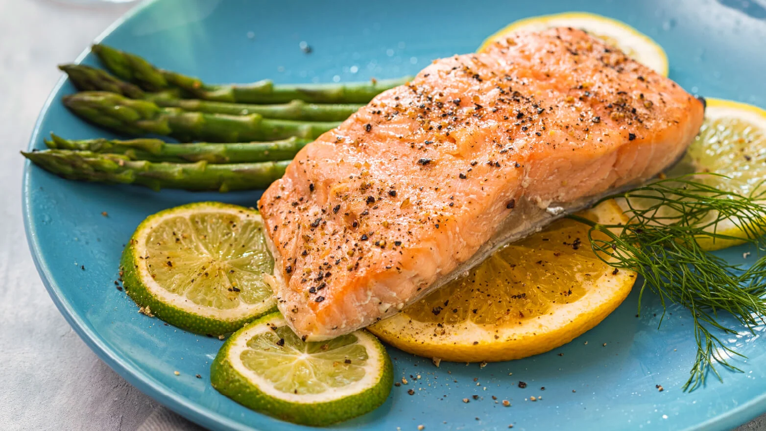 a photo of baked salmon with asparagus