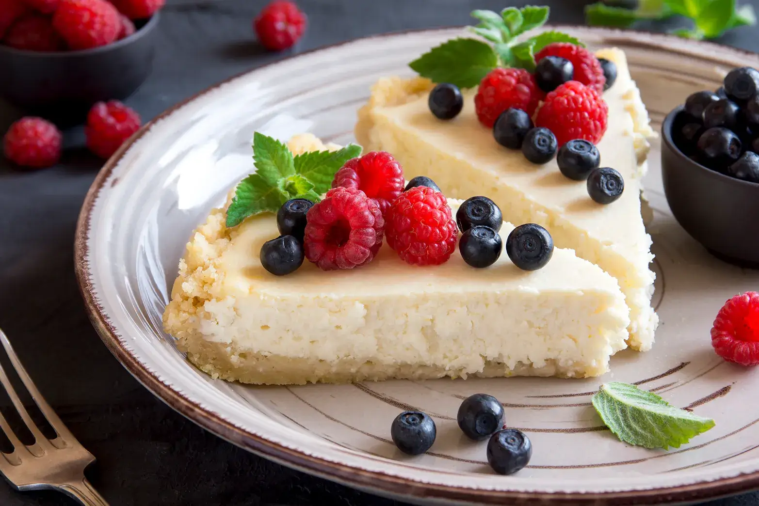 cheesecake with blueberries and raspberries on top